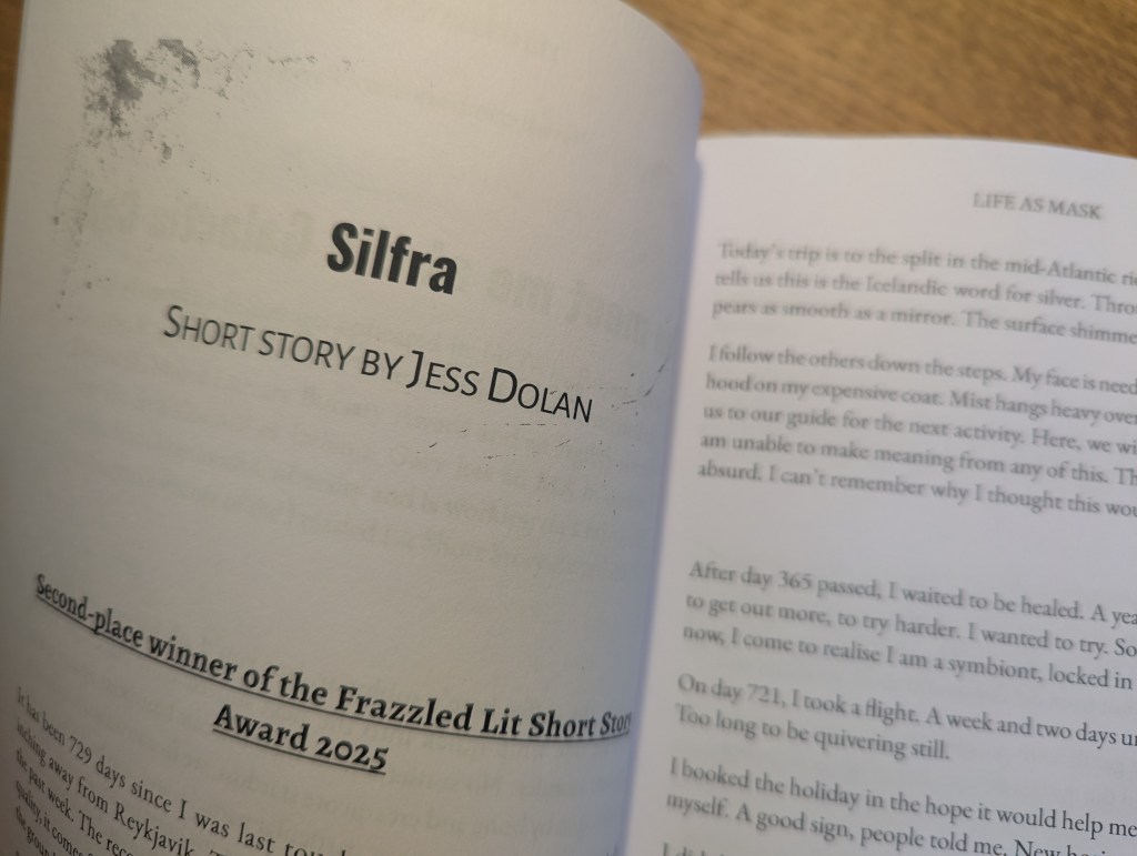 Open book showing title page of Silfra